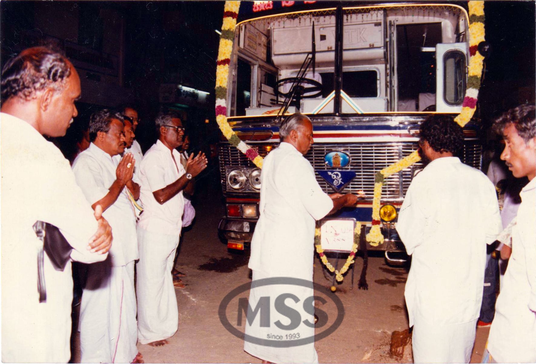 A ceremony beside a decorated Mettur Super Services bus