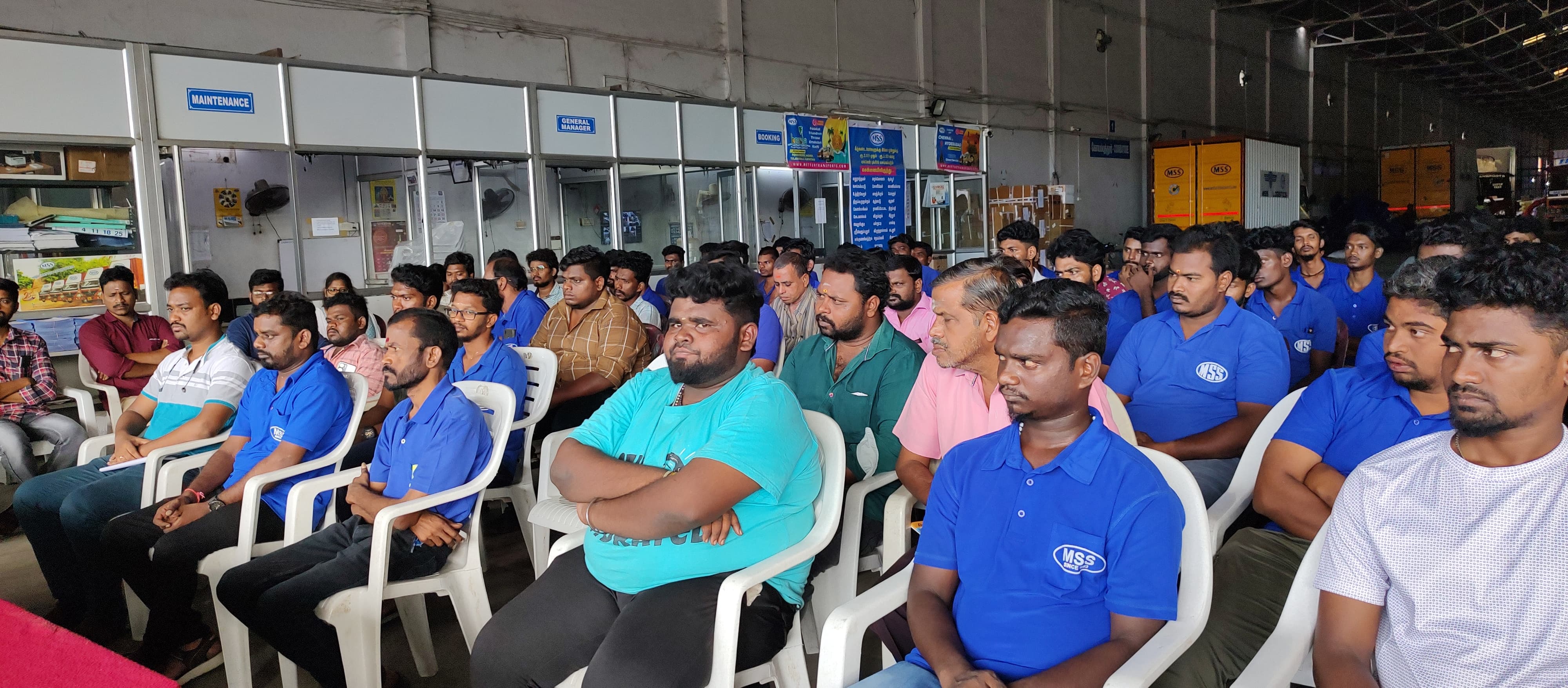 Mettur Transports staff gathered for a team meeting at a transport hub